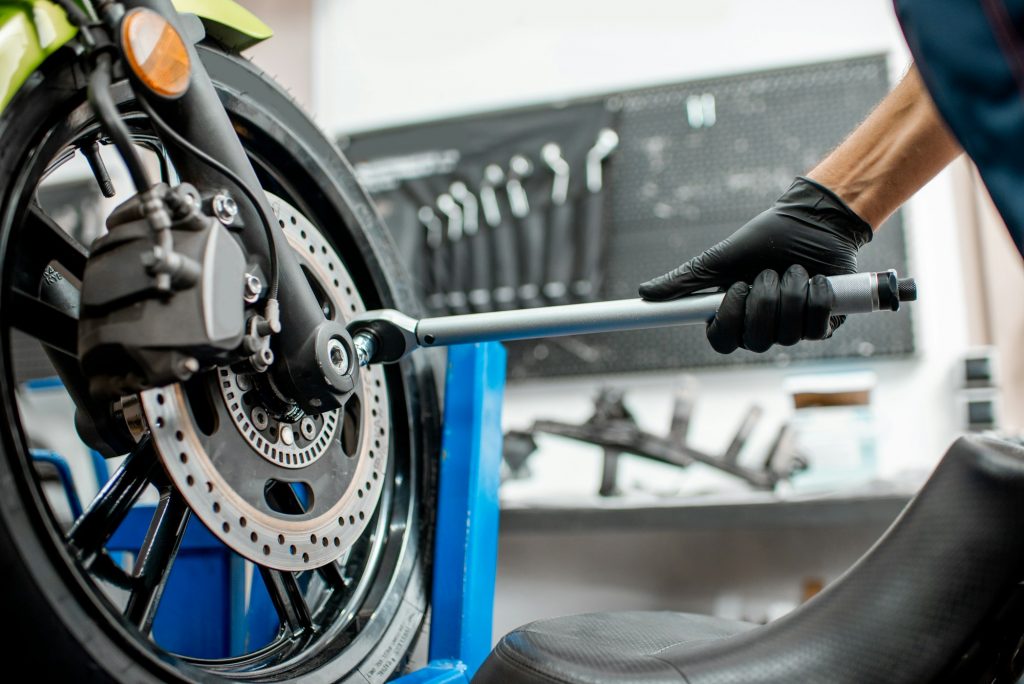 Repairing motorcycle at the workshop